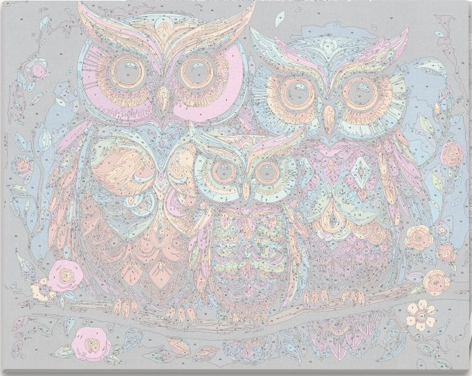 In the image, a trio of vibrant owls is perched on a branch against a dark night sky.