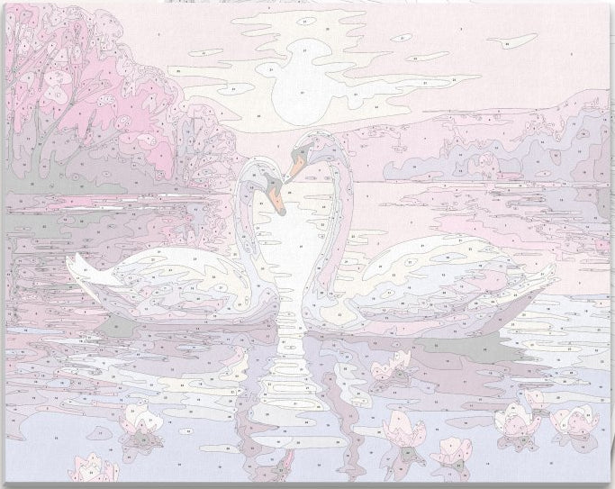 The image features two white swans floating on a serene lake at sunset.