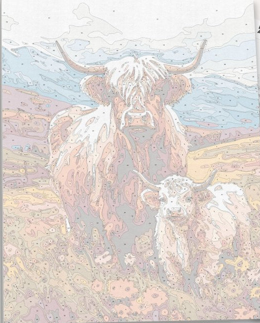 In the image, two cows, one larger and one smaller, are standing together on a grassy hillside.