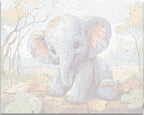 A young elephant with large ears and big eyes sits playfully on a pile of autumn leaves, its trunk resting gently on the ground..