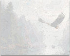A majestic eagle in flight over a serene forest and river, with several birds scattered in the sky below.