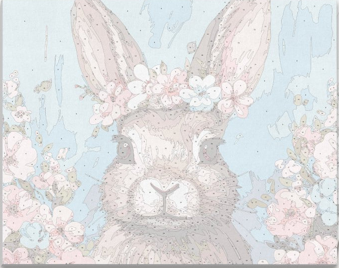 An illustration of a rabbit with floral headband against blue backdrop filled with flower motifs..